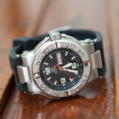 REACTOR® Critical Mass Analog Men's Watch - Built for durability, strength and style, this watch has a sleek black dial and durable black leather straps.  Features day/date display, Japanese quartz movement, unidirectional rotating bezel, 316L  stainless steel case and caseback.  Water protected up to 100 meters. Superluminova on hands and markers.